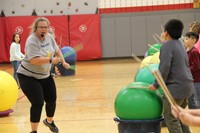 instructor and student participating in drums alive