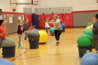 instructor walking down line of students