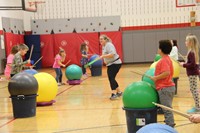 instructor dancing down line in drums alive activity