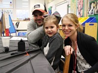 three people smiling