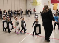 students parading around the gym 7