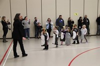 students parading around the gym 2