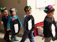 students dressed as penguins