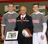coach zanot with two players holding picture