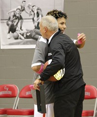 coach zanot and player hug