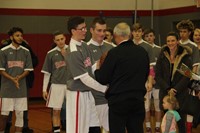 students giving coach zanot item for recognition of 300th win