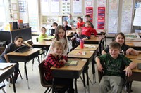 another second grade class smiling