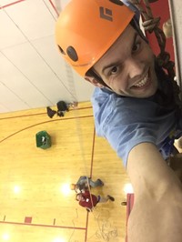 staff member taking a selfie rock climbing