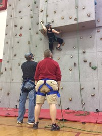 staff member rock climbing