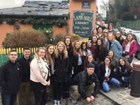 group of students in front of french building