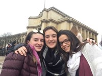 students in front of building