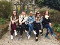 students sitting on bench