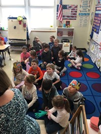 students watching woman present