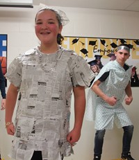 two students dressed up for recycled fashion show