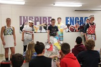 wide shot of students taking part in recycled fashion show