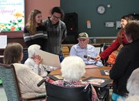 resident being interviewed at table