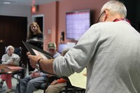 teacher holding drawing