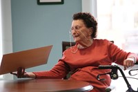 woman showing another person drawing of herself