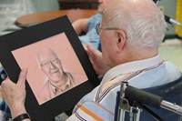 man looking at drawing close up