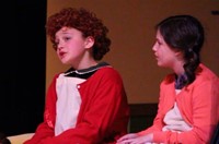 students singing in annie junior