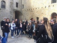 students getting a tour of castle