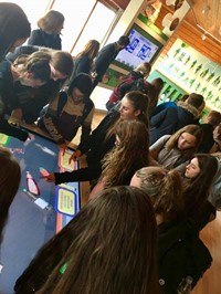 students looking at demonstration on screen