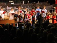 wide shot of students singing