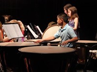 student playing drums