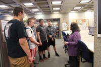 woman talking to students about online records