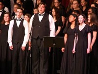 three students singing