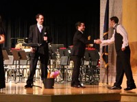 student giving teacher hand shake