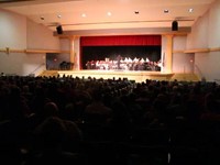 wide shot of auditorium with band performing