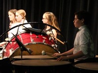 medium shot of more students playing instruments