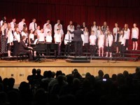 medium shot of students singing