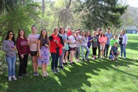 group of students holding green bean seeds