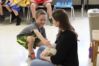 student petting goat 6