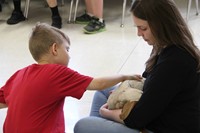 student petting goat 5