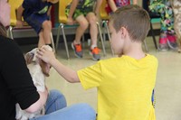 student petting goat 3