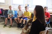 students listening to instructor speak