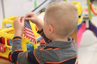 student holding flag