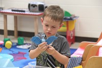 student holding toy