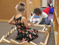 students building blocks together