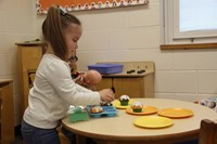 students playing in kitchen