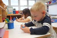 two students drawing