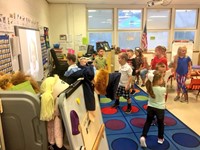 more students dancing in classroom