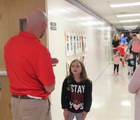 teacher talking to student