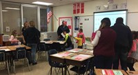 people in classroom at open house