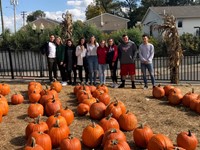 Chenango Valley French Exchange students at Cider Mill with pumpkins