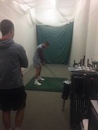 Chenango Valley French Exchange student practicing golfing