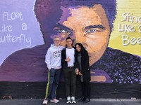 Chenango Valley French Exchange students in front of mural